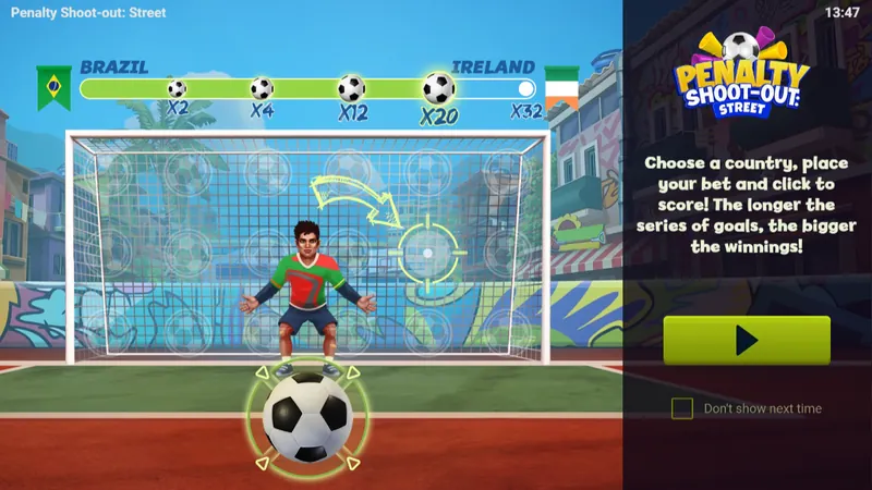 Tutoriel de Penalty Shoot-out: Street : la barre Brazil contre Ireland avec quatre ballons de x2 à x20 et x32 au bout, la consigne anglaise « Choose a country, place your bet and click to score! » et la case « Don't show next time »